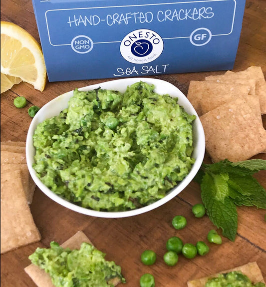 Onesto's recipe for gluten-free, vegan Spring Pea and Mint Dip, served with Onesto's gluten-free and vegan Sea Salt crackers