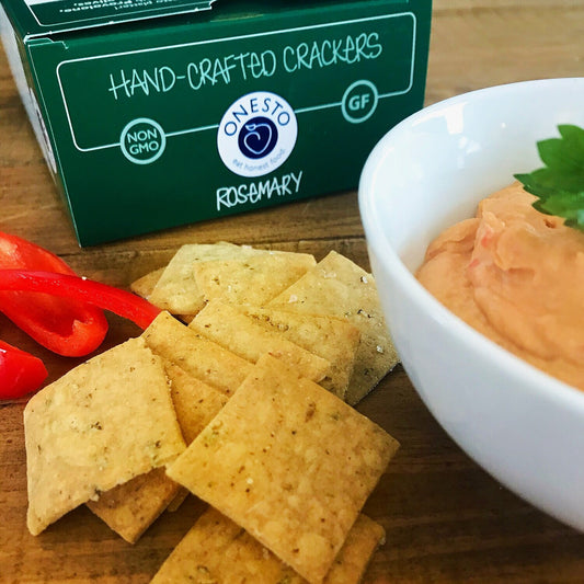 Onesto's Recipe for a gluten-free, vegan Red Pepper Hummus served with Onesto's gluten-free Rosemary crackers.